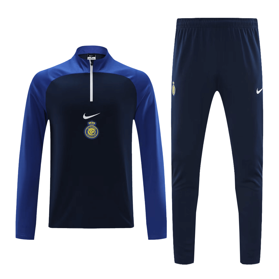 cedc4bae1642f16a83bed8670e8919d5.png Al Nassr 1/4 Zip Tracksuit 2023/24 Blue&Black - Image 1